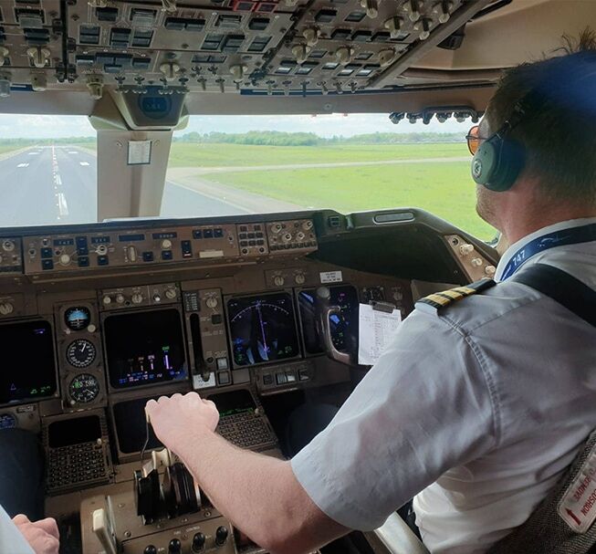 Pilot in cockpit during landing approach