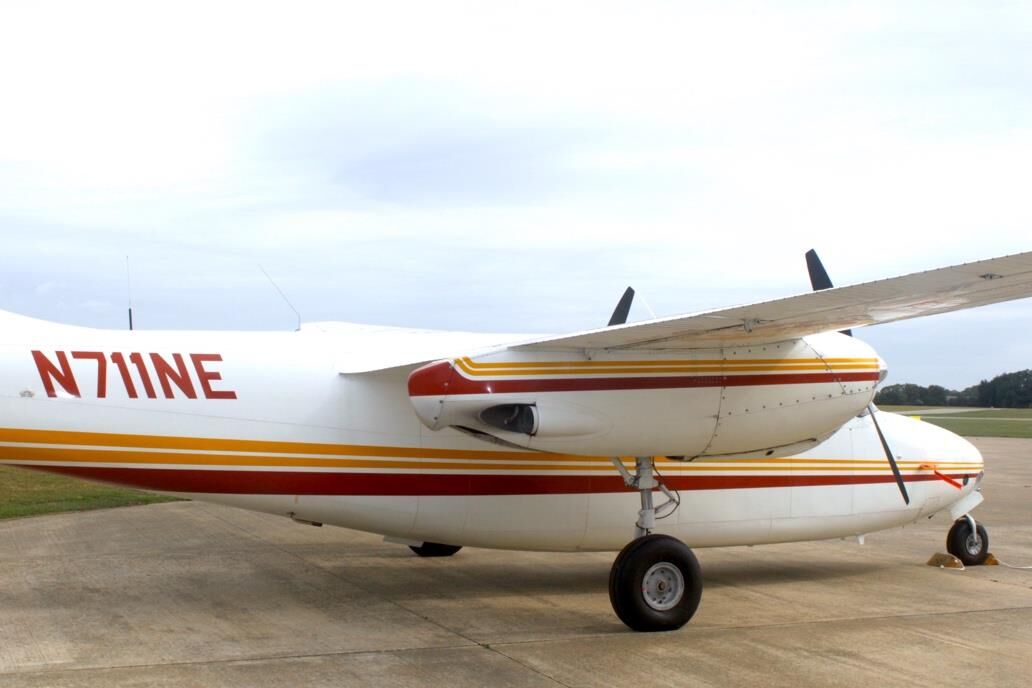 Aero Commander 500 N711NE side view showing tail section and engine nacelles