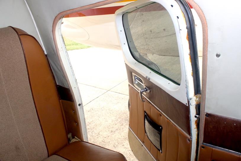 1959 Aero Commander 500A N711NE cabin interior with open passenger door